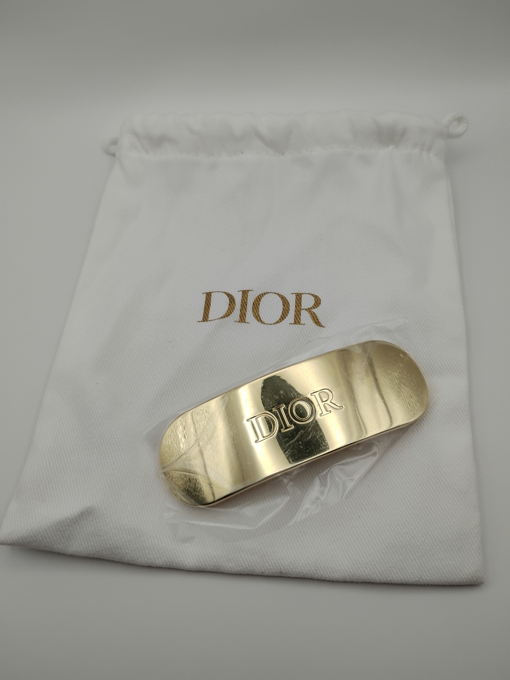 Dior Gold Branded Metal Hair Clip With A Dior Bag Both Are Brand New